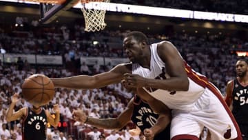 May 9, 2016; Miami, FL, USA; Miami Heat forward Luol Deng (9) reacts for a loose ball as Toronto Raptors guard DeMar DeRozan (10) defends during the fourth quarter in game four of the second round of the NBA Playoffs at American Airlines Arena. The Heat won in overtime 94-87. Mandatory Credit: Steve Mitchell-USA TODAY Sports