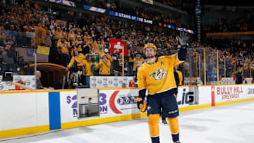 NASHVILLE, TN - FEBRUARY 13: Filip Forsberg #9 of the Nashville Predators waves to the crowd after his overtime game winning penalty shot against the St. Louis Blues during an NHL game at Bridgestone Arena on February 13, 2018 in Nashville, Tennessee. (Photo by John Russell/NHLI via Getty Images)