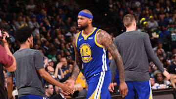 OAKLAND, CA - MARCH 5: Demarcus Cousins #0 hi-fives Quinn Cook #4 of the Golden State Warriors on March 5, 2019 at ORACLE Arena in Oakland, California. NOTE TO USER: User expressly acknowledges and agrees that, by downloading and or using this photograph, user is consenting to the terms and conditions of Getty Images License Agreement. Mandatory Copyright Notice: Copyright 2019 NBAE (Photo by Noah Graham/NBAE via Getty Images)
