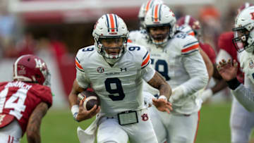 Auburn footballNov 26, 2022; Tuscaloosa, Alabama, USA; Auburn Tigers quarterback Robby Ashford (9) carries the ball against the Alabama Crimson Tide at Bryant-Denny Stadium. Mandatory Credit: Marvin Gentry-USA TODAY Sports
