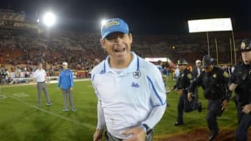 Nov 30, 2013; Los Angeles, CA, USA; UCLA Bruins coach Jim Mora celebrates at the end of the game against the Southern California Trojans at Los Angeles Memorial Coliseum. Mandatory Credit: Kirby Lee-USA TODAY Sports