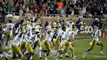 Sep 5, 2021; Tallahassee, Florida, USA; Notre Dame Fighting Irish players storm the field after beating the Florida State Seminoles in overtime at Doak S. Campbell Stadium. Mandatory Credit: Melina Myers-USA TODAY Sports
