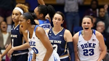 Feb 1, 2016; Durham, NC, USA; Duke Blue Devils forward/center Amber Henson (30) and guard Rebecca Greenwell (23) react after a basket in the second half against the Notre Dame Fighting Irish at Cameron Indoor Stadium. Mandatory Credit: Mark Dolejs-USA TODAY Sports