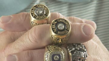 Pat Riley Head Coach of the Miami Heat poses with six of his championship rings (Photo by Victor Baldizon/NBAE via Getty Images)