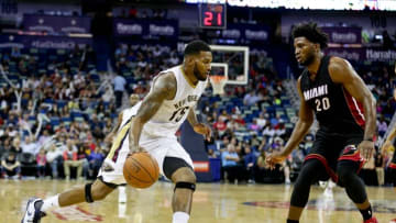 Oct 23, 2015; New Orleans, LA, USA; New Orleans Pelicans forward Alonzo Gee (15) drives past Miami Heat forward Justise Winslow (20) during the second half of a game at the Smoothie King Center. The Pelicans defeated the Heat 93-90. Mandatory Credit: Derick E. Hingle-USA TODAY Sports