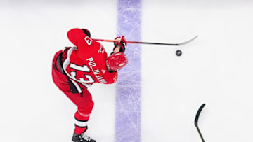 Apr 11, 2023; Raleigh, North Carolina, USA; Carolina Hurricanes right wing Jesse Puljujarvi (13) skates with the puck against the Detroit Red Wings during the second period at PNC Arena. Mandatory Credit: James Guillory-USA TODAY Sports