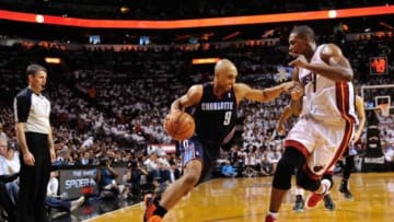 Apr 23, 2014; Miami, FL, USA; Charlotte Bobcats guard Gerald Henderson (9) drives to the basket as Miami Heat center Chris Bosh (1) defends in game two during the first round of the 2014 NBA Playoffs at American Airlines Arena. Mandatory Credit: Steve Mitchell-USA TODAY Sports