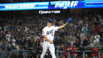 LOS ANGELES, CALIFORNIA - OCTOBER 09: Walker Buehler #21 of the Los Angeles Dodgers acknowledges the crowd after being pulled in the seventh inning of game five of the National League Division Series against the Washington Nationals at Dodger Stadium on October 09, 2019 in Los Angeles, California. (Photo by Harry How/Getty Images)