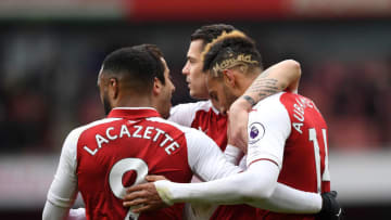 LONDON, ENGLAND - APRIL 01: Pierre-Emerick Aubameyang of Arsenal celebrates after scoring his sides second goal with Alexandre Lacazette of Arsenal and his team mates during the Premier League match between Arsenal and Stoke City at Emirates Stadium on April 1, 2018 in London, England. (Photo by Shaun Botterill/Getty Images)