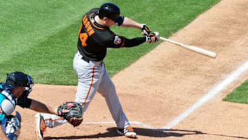 Mar 16, 2016; Peoria, AZ, USA; San Francisco Giants catcher Trevor Brown (14) hist an RBI single in the third inning against the Seattle Mariners at Peoria Sports Complex. Mandatory Credit: Matt Kartozian-USA TODAY Sports