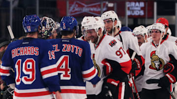 NEW YORK, NY - APRIL 26: Matt Gilroy #97 of the Ottawa Senators congratulates Henrik Lundqvist #30 of the New York Rangers and his teammates after the Rangers defeated the Senators 2 to 1 in Game Seven of the Eastern Conference Quarterfinals during the 2012 NHL Stanley Cup Playoffs at Madison Square Garden on April 26, 2012 in New York City. (Photo by Bruce Bennett/Getty Images)