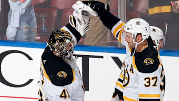 SUNRISE, FL - DECEMBER 14: Goaltender Jaroslav Halak #41 and Patrice Bergeron #37 of the Boston Bruins celebrates their 4-2 win against the Florida Panthers at the BB&T Center on December 14, 2019 in Sunrise, Florida. (Photo by Eliot J. Schechter/NHLI via Getty Images)