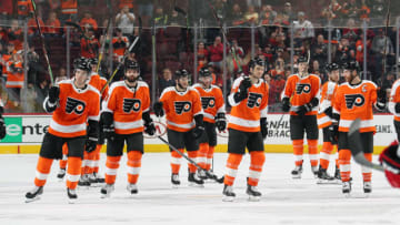 PHILADELPHIA, PA - APRIL 06: Members of the Philadelphia Flyers salute their fans after being defeated 4-3 by the Carolina Hurricanes on April 6, 2019 at the Wells Fargo Center in Philadelphia, Pennsylvania. Tonight's game is the final game of the Flyers season. (Photo by Len Redkoles/NHLI via Getty Images)