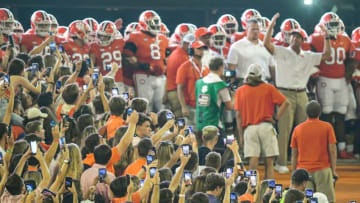 Clemson fans get out their cell phones for a photo of head coach Dabo Swinney and the team at HowardÕs Rock before running down the hill, before the game with Boston College at Memorial Stadium in Clemson, S.C., October 2, 2021.Ncaa Football Acc Clemson Boston College