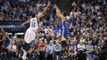 Nov 12, 2015; Minneapolis, MN, USA; Golden State Warriors guard Stephen Curry (30) shoots in the fourth quarter against Minnesota Timberwolves center Karl-Anthony Towns (32) at Target Center. The Golden State Warriors beat he Minnesota Timberwolves 129-116. Mandatory Credit: Brad Rempel-USA TODAY Sports