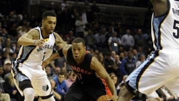 Jan 21, 2015; Memphis, TN, USA; Toronto Raptors guard Kyle Lowry (7) goes to the basket against Memphis Grizzlies guard Courtney Lee (5) during the game at FedExForum. Memphis Grizzlies beat Toronto Raptors 92 - 86. Mandatory Credit: Justin Ford-USA TODAY Sports