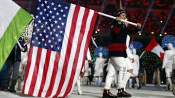 Feb 23, 2014; Sochi, RUSSIA; USA flag bearer Julie Chu during the closing ceremony for the Sochi 2014 Olympic Winter Games at Fisht Olympic Stadium. Mandatory Credit: Jeff Swinger-USA TODAY Sports