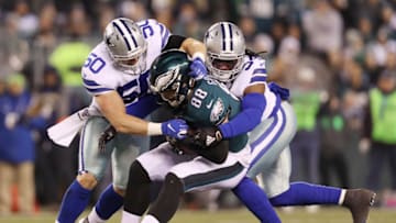 PHILADELPHIA, PENNSYLVANIA - DECEMBER 22: Dallas Goedert #88 of the Philadelphia Eagles is tackled by Sean Lee #50 and Jaylon Smith #54 of the Dallas Cowboys during the first half in the game at Lincoln Financial Field on December 22, 2019 in Philadelphia, Pennsylvania. (Photo by Patrick Smith/Getty Images)