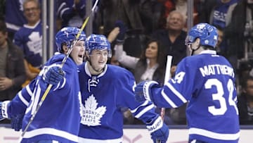 Nov 5, 2016; Toronto, Ontario, CAN; Toronto Maple Leafs forward Auston Matthews (34) and forward William Nylander (29) congratulate defenseman Jake Gardiner (51) on his goal against the Vancouver Canucks at Air Canada Centre. Toronto defeated Vancouver 6-3. Mandatory Credit: John E. Sokolowski-USA TODAY Sports