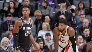 SACRAMENTO, CA - DECEMBER 31: Buddy Hield #24 of the Sacramento Kings defends Paul George #13 of the Los Angeles Clippers on December 31, 2019 at Golden 1 Center in Sacramento, California. NOTE TO USER: User expressly acknowledges and agrees that, by downloading and or using this photograph, User is consenting to the terms and conditions of the Getty Images Agreement. Mandatory Copyright Notice: Copyright 2019 NBAE (Photo by Rocky Widner/NBAE via Getty Images)