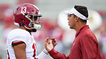 FAYETTEVILLE, AR - OCTOBER 6: Tua Tagovailoa #13 talks with Associate Head Coach Dan Enos of the Alabama Crimson Tide before a game against the Arkansas Razorbacks at Razorback Stadium on October 6, 2018 in Tuscaloosa, Alabamai. (Photo by Wesley Hitt/Getty Images)