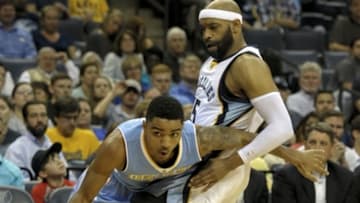Mar 16, 2015; Memphis, TN, USA; Denver Nuggets guard Gary Harris (14) handles the ball against Memphis Grizzlies guard Vince Carter (15) during the game at FedExForum. Memphis Grizzlies beat Denver Nuggets 92-81.Mandatory Credit: Justin Ford-USA TODAY Sports