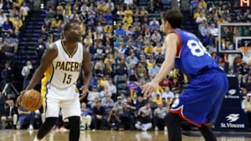 Oct 29, 2014; Indianapolis, IN, USA; Indiana Pacers guard Donald Sloan (15) is guarded by Philadelphia 76ers guard Alexey Shved (88) at Bankers Life Fieldhouse. Indiana defeats Philadelphia 103-91. Mandatory Credit: Brian Spurlock-USA TODAY Sports