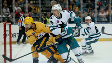 PRAGUE, CZECH REPUBLIC - OCTOBER 07: Alexander Carrier #45 of Nashville Predators challenges Matt Benning #5 of San Jose Sharks during the 2022 NHL Global Series Challenge Series Czech Republic between Nashville Predators and San Jose Sharks at O2 Arena on October 07, 2022 in Prague, Czech Republic. (Photo by Martin Rose/Getty Images)