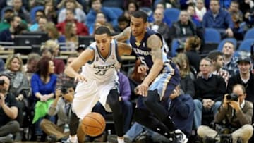 Jan 31, 2014; Minneapolis, MN, USA; Memphis Grizzlies guard Courtney Lee (5) pokes the ball away from Minnesota Timberwolves guard Kevin Martin (23) during the first quarter at Target Center. Mandatory Credit: Brace Hemmelgarn-USA TODAY Sports
