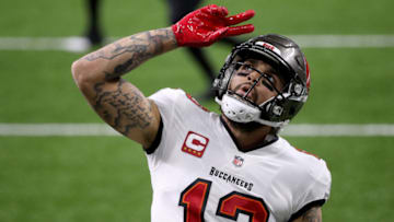 NEW ORLEANS, LOUISIANA - JANUARY 17: Mike Evans #13 of the Tampa Bay Buccaneers celebrates after scoring a 3 yard touchdown against the New Orleans Saints during the second quarter in the NFC Divisional Playoff game at Mercedes Benz Superdome on January 17, 2021 in New Orleans, Louisiana. (Photo by Chris Graythen/Getty Images)