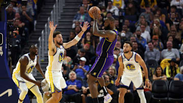 SAN FRANCISCO, CALIFORNIA - OCTOBER 18: LeBron James #6 of the Los Angeles Lakers looks to pass as Klay Thompson #11, Stephen Curry #30, and Draymond Green #23 of the Golden State Warriors defend during the 1st half of the game at Chase Center on October 18, 2022 in San Francisco, California. NOTE TO USER: User expressly acknowledges and agrees that, by downloading and or using this photograph, User is consenting to the terms and conditions of the Getty Images License Agreement. (Photo by Ezra Shaw/Getty Images)