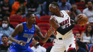 Miami Heat center Bam Adebayo (13) protects the basketball from Dallas Mavericks forward Dorian Finney-Smith (10)( Sam Navarro-USA TODAY Sports)