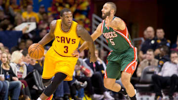 CLEVELAND, OH - DECEMBER 31: Dion Waiters #3 of the Cleveland Cavaliers drives around Kendall Marshall #5 of the Milwaukee Bucks during the first half at Quicken Loans Arena on December 31, 2014 in Cleveland, Ohio. NOTE TO USER: User expressly acknowledges and agrees that, by downloading and or using this photograph, User is consenting to the terms and conditions of the Getty Images License Agreement. (Photo by Jason Miller/Getty Images)
