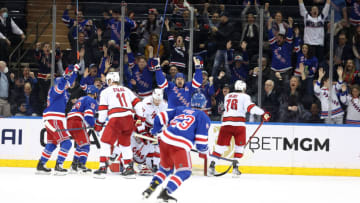 NEW YORK, NEW YORK - APRIL 12: Chris Kreider #20 of the New York Rangers celebrates after becoming the fourth player in New York Rangers history to score 50 goals in a season in the third period against the Carolina Hurricanes at Madison Square Garden on April 12, 2022 in New York City. (Photo by Al Bello/Getty Images)