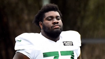 FLORHAM PARK, NEW JERSEY - AUGUST 19: Mekhi Becton #77 of the New York Jets looks on during training camp at Atlantic Health Jets Training Center on August 19, 2020 in Florham Park, New Jersey. (Photo by Robert Sabo-Pool/Getty Images)