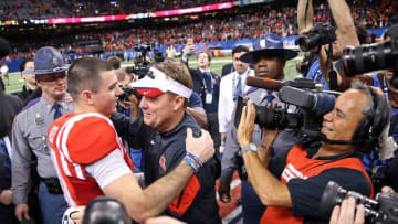 Jan 1, 2016; New Orleans, LA, USA; Mississippi Rebels quarterback Chad Kelly (10) hugs head coach Hugh Freeze at the end of the 2016 Sugar Bowl against the Oklahoma State Cowboys at the Mercedes-Benz Superdome. Mississippi won, 48-20. Mandatory Credit: Chuck Cook-USA TODAY Sports