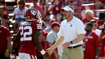 Sep 7, 2019; Norman, OK, USA; Oklahoma Sooners defensive coordinator Alex Grinch speaks with safety Jeremiah Criddell (22) before the game against the South Dakota Coyotes at Gaylord Family - Oklahoma Memorial Stadium. Mandatory Credit: Kevin Jairaj-USA TODAY Sports