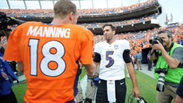 Sep 13, 2015; Denver, CO, USA; Baltimore Ravens quarterback Joe Flacco (5) shakes hands with Denver Broncos quarterback Peyton Manning (18) after their game at Sports Authority Field at Mile High. The Broncos won 19-13. Mandatory Credit: Ron Chenoy-USA TODAY Sports