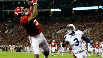 TUSCALOOSA, AL - NOVEMBER 29: Amari Cooper #9 of the Alabama Crimson Tide catches a 17 yard touchdown pass from Blake Sims #6 in the first quarter against Jonathan Jones #3 of the Auburn Tigers during the Iron Bowl at Bryant-Denny Stadium on November 29, 2014 in Tuscaloosa, Alabama. (Photo by Kevin C. Cox/Getty Images)