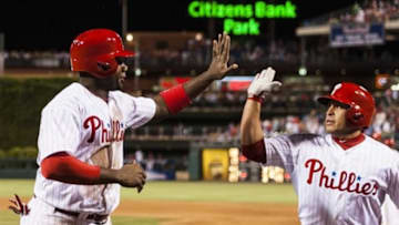 May 17, 2013; Philadelphia, PA, USA; Philadelphia Phillies first baseman Ryan Howard (6) celebrates scoring with catcher Carlos Ruiz (51) during the eighth inning against the Cincinnati Reds at Citizens Bank Park. The Phillies defeated the Reds 5-3. Mandatory Credit: Howard Smith-USA TODAY Sports