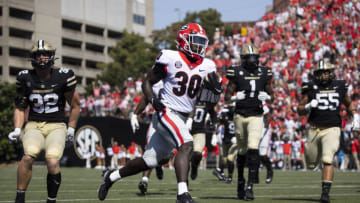NASHVILLE, TN - SEPTEMBER 25: Daijun Edwards #30 of the Georgia Bulldogs runs the ball for a touchdown against the Vanderbilt Commodores during the fourth quarter at Vanderbilt Stadium on September 25, 2021 in Nashville, Tennessee. Georgia defeats Vanderbilt 62-0. (Photo by Brett Carlsen/Getty Images)