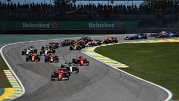 SAO PAULO, BRAZIL - NOVEMBER 12: Sebastian Vettel of Germany driving the (5) Scuderia Ferrari SF70H leads Valtteri Bottas driving the (77) Mercedes AMG Petronas F1 Team Mercedes F1 WO8 Kimi Raikkonen of Finland driving the (7) Scuderia Ferrari SF70H and the rest of the field toward turn two during the Formula One Grand Prix of Brazil at Autodromo Jose Carlos Pace on November 12, 2017 in Sao Paulo, Brazil. (Photo by Dan Istitene/Getty Images)