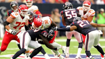Sep 18, 2016; Houston, TX, USA; Houston Texans outside linebacker Whitney Mercilus (59) forces a fumble on Kansas City Chiefs running back Spencer Ware (32) during the second quarter against the Houston Texans at NRG Stadium. Mandatory Credit: Erik Williams-USA TODAY Sports
