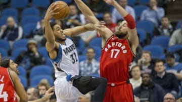 Feb 10, 2016; Minneapolis, MN, USA; Minnesota Timberwolves center Karl-Anthony Towns (32) drives to the basket against Toronto Raptors center Jonas Valanciunas (17) in the first half at Target Center. Mandatory Credit: Jesse Johnson-USA TODAY Sports