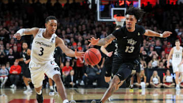 Cincinnati Bearcats guard Mika Adams-Woods chases down loose ball against UCF Knights at Fifth Third Arena. USA Today.
