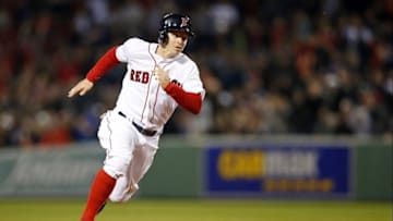 Apr 30, 2016; Boston, MA, USA; Boston Red Sox left fielder Brock Holt (12) rounds second base on his way to score on a hit by center fielder Jackie Bradley Jr. (not pictured) during the sixth inning against the New York Yankees at Fenway Park. Mandatory Credit: Greg M. Cooper-USA TODAY Sports