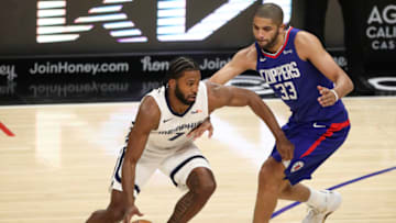 LOS ANGELES, CALIFORNIA - APRIL 21: Justise Winslow #7 of the Memphis Grizzlies handles the ball defended by Nicolas Batum #33 of the LA Clippers (Photo by Meg Oliphant/Getty Images)