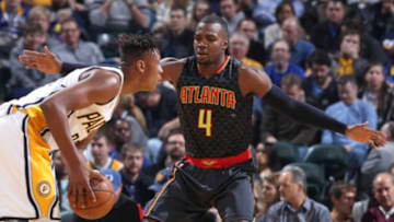 Jan 28, 2016; Indianapolis, IN, USA; Indiana Pacers center Myles Turner (33) holds the ball as Atlanta Hawks forward Paul Millsap (4) defends at Bankers Life Fieldhouse. The Pacers won 111-92. Mandatory Credit: Brian Spurlock-USA TODAY Sports