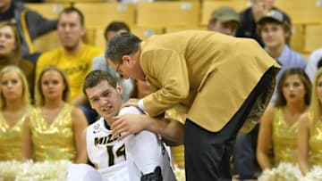 Jan 4, 2017; Columbia, MO, USA; Missouri Tigers forward Reed Nikko (14) is attended to by medical staff after an injury during the first half against the LSU Tigers at Mizzou Arena. Mandatory Credit: Denny Medley-USA TODAY Sports