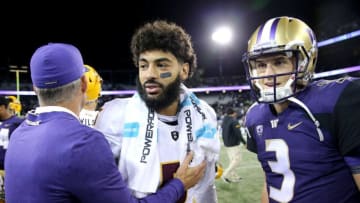 SEATTLE, WA: Head Coach Chris Petersen of the Washington Huskies, Manny Wilkins #5 of the Arizona State Sun Devils and Jake Browning #3 of the Washington Huskies shake hands after the Washington Huskies defeated the Arizona State Sun Devils 27-20 at Husky Stadium on September 22, 2018. (Photo by Abbie Parr/Getty Images)